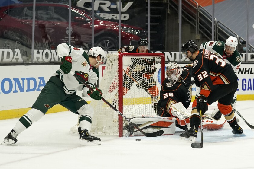 Ducks goaltender John Gibson stops a shot from Minnesota Wild center Joel Eriksson Ek.