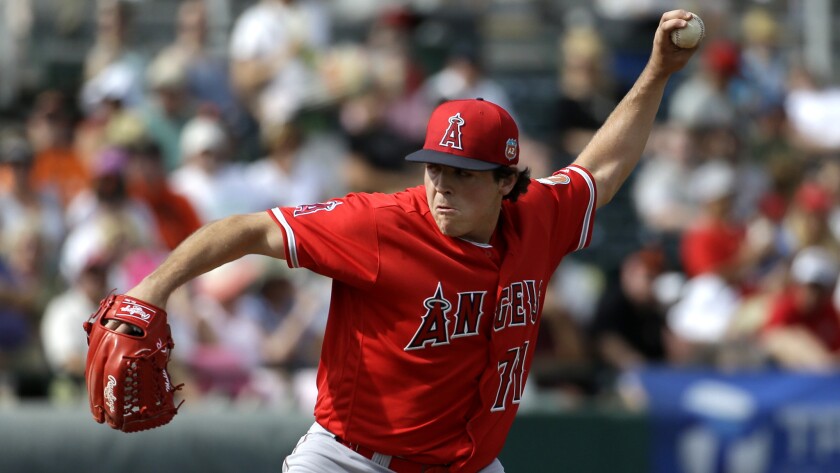 Angels reliever Greg Mahle delivers during a spring training game against the Giants on Mar. 3.