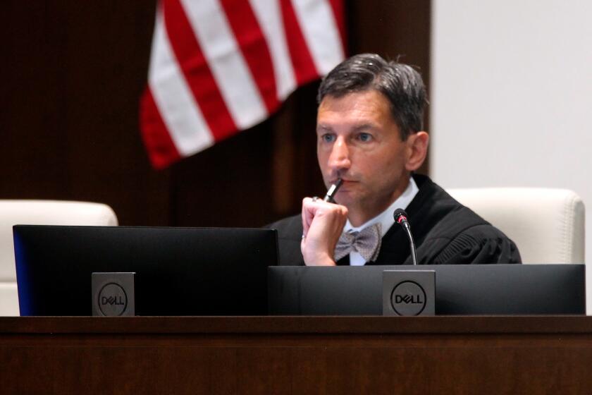 Denise District Judge K. Christopher Jayaram follows arguments from attorneys as they argue over a new state law on how providers dispense abortion medications in Johnson County District Court, Tuesday, Aug. 8, 2023, in Olathe, Kan. (AP Photo/John Hanna)