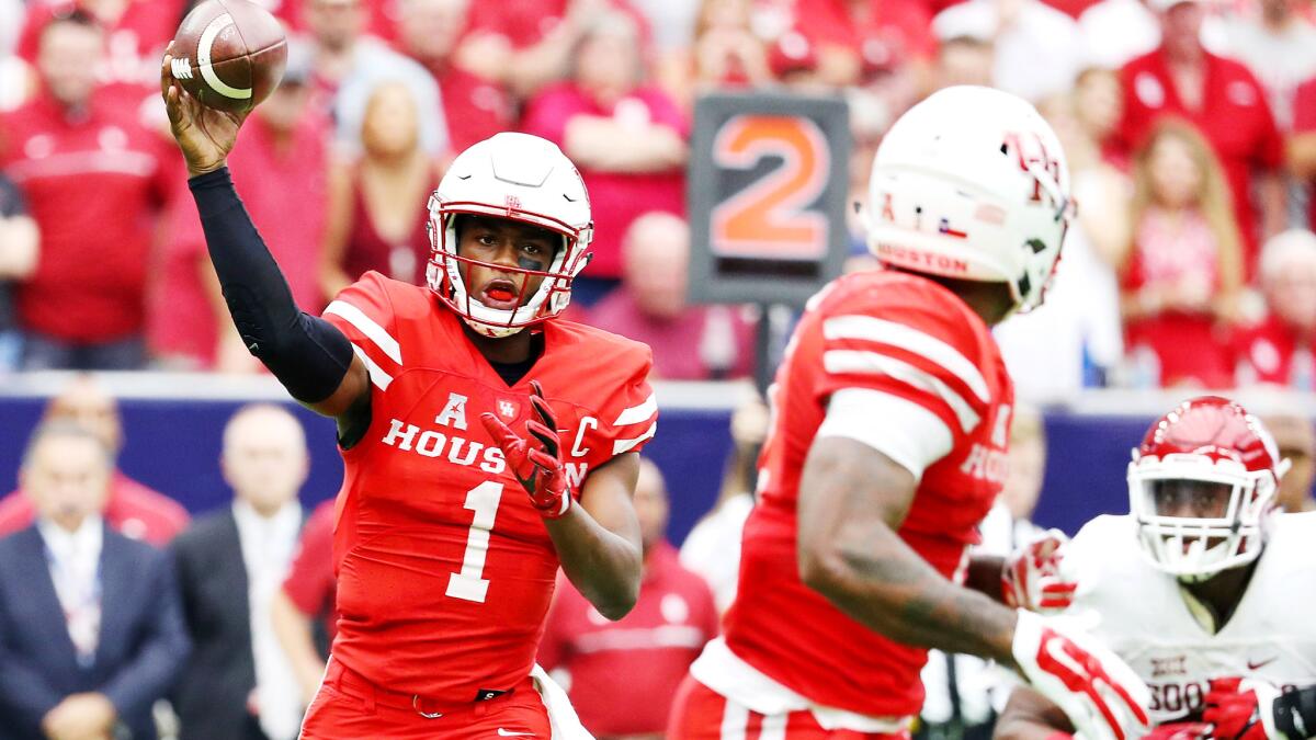 Quarterback Greg Ward Jr. swings a pass to a Houston teammate during their upset of Oklahoma on Saturday.