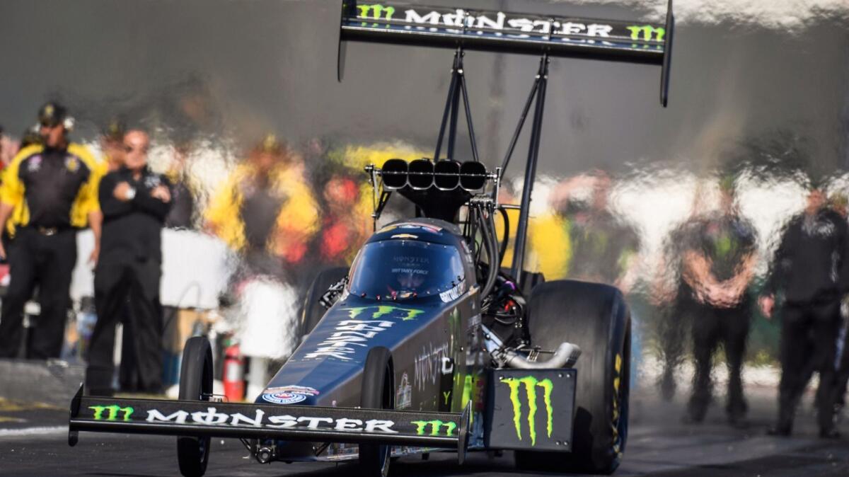 Top-fuel driver Brittany Force makes a pass during qualifying at the NHRA Finals on Friday in Pomona.
