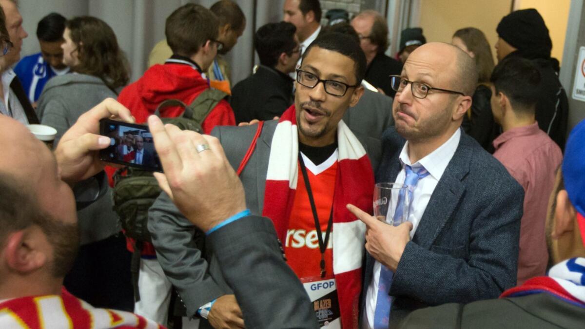 "Men in Blazers" star Roger Bennett poses with a fan at the inaugural BlazerCon on Nov. 14, 2015 in New York.