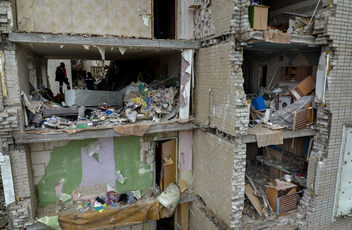 A damaged building with interiors exposed