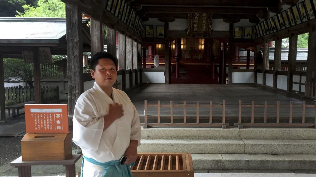 Yoshihiro Suzuki, a 32-year-old Shinto priest at the Munakata Taisha shrine.