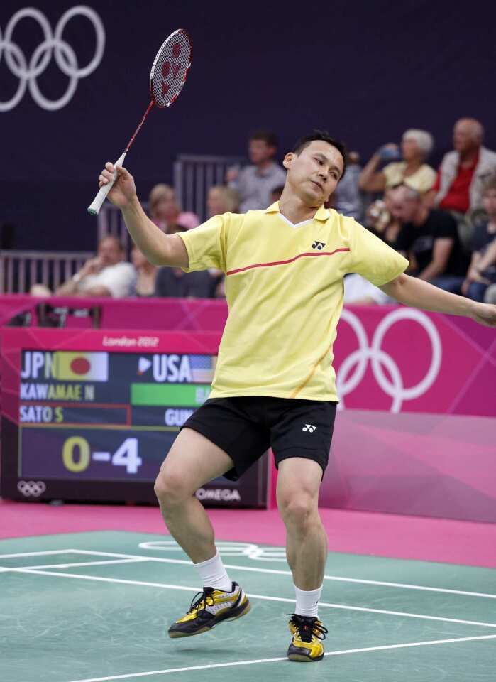 Tony Gunawan reacts to a shot during competition at the London Olympics.