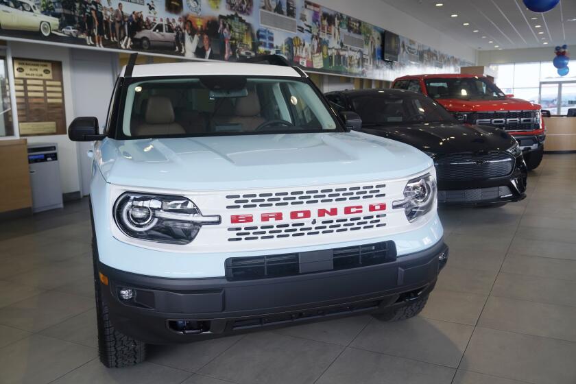 File -A Ford Bronco is displayed at a Gus Machado Ford dealership on Jan. 23, 2023, in Hialeah, Fla. The U.S. government's auto safety agency has opened an investigation, Friday, April 12, 2024, into a Ford recall for gasoline leaks from cracked fuel injectors that can cause engine fires, saying in documents that the remedy doesn't fix the leaks. (AP Photo/Marta Lavandier, File)