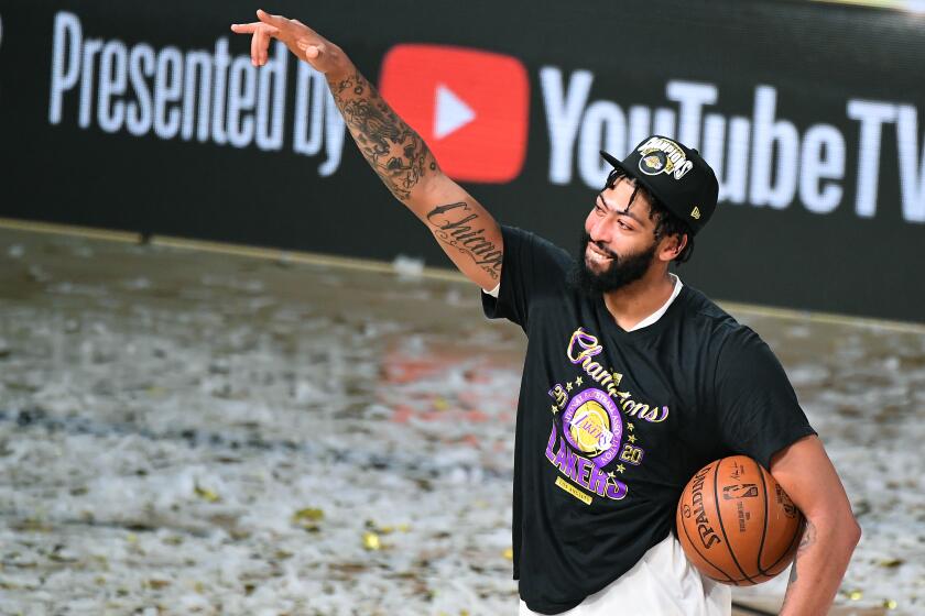ORLANDO, FLORIDA OCTOBER 11, 2020- Lakers Anthony Davis celebrates the NBA Championship in Game 6 of the NBA FInals in Orlando Sunday. (Wally Skalij/Los Angeles Times)