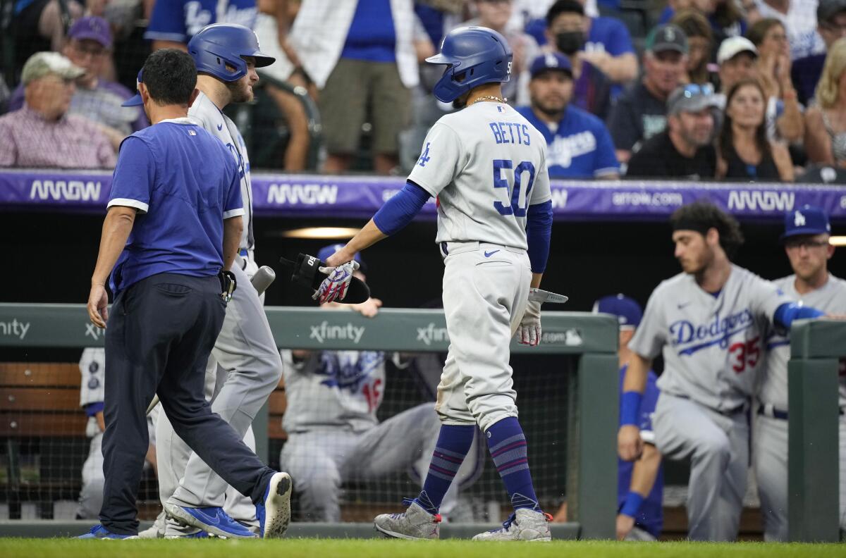 The Dodgers' Mookie Betts (50) leaves the game after doubling during the seventh inning.