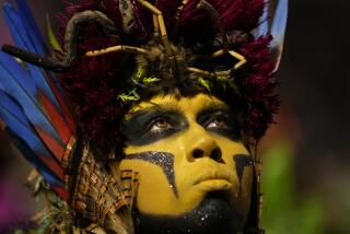 A performer from the Salgueiro samba school parades during Carnival celebrations at the Sambadrome in Rio de Janeiro, Brazil, Monday, Feb. 12, 2024. (AP Photo/Silvia Izquierdo)