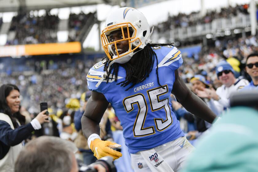 Los Angeles Chargers running back Melvin Gordon celebrates after scoring during the first half of an NFL football game against the Oakland Raiders Sunday, Dec. 22, 2019, in Carson, Calif. (AP Photo/Kelvin Kuo)