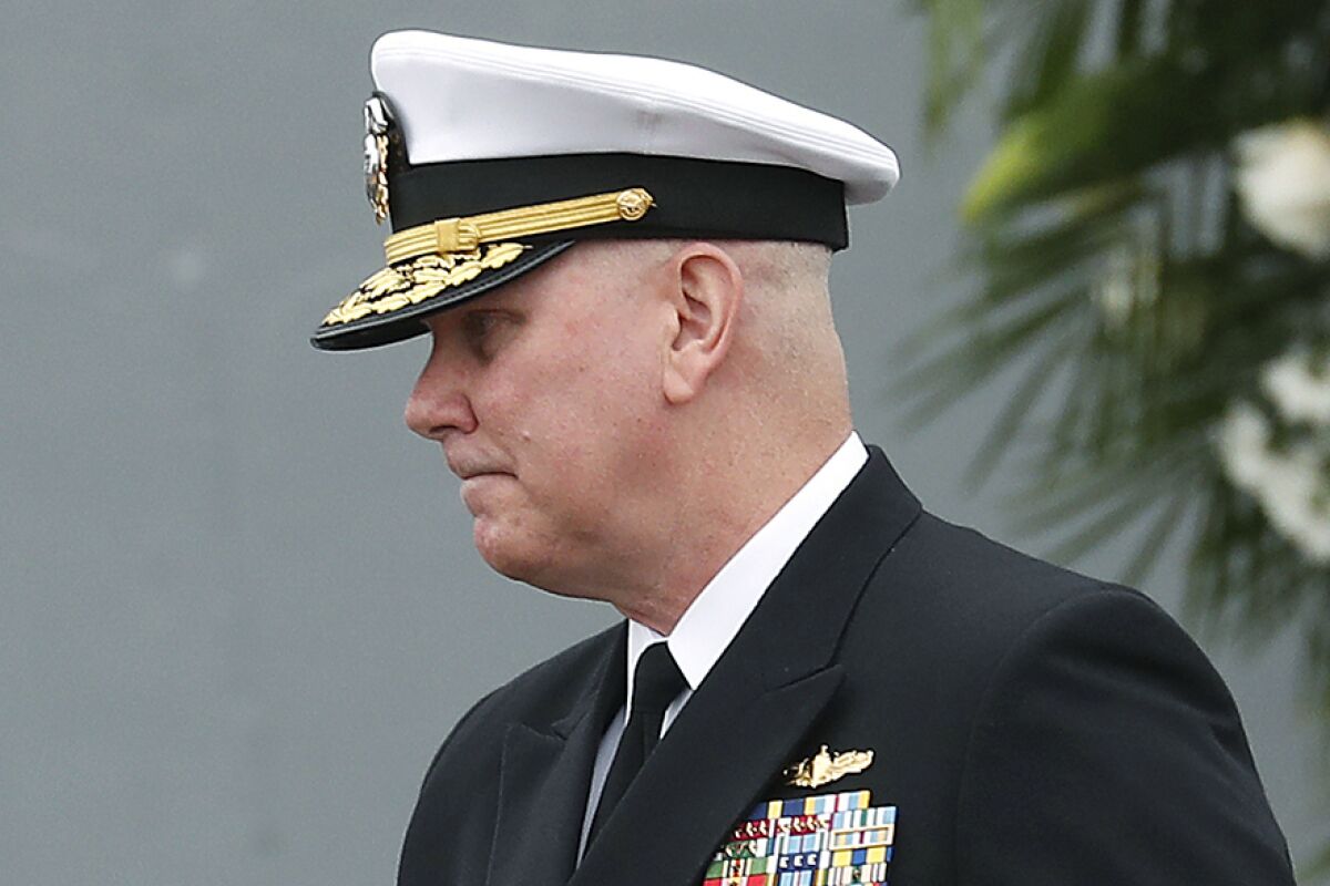 FILE - Navy Adm. Christopher Grady, center, before speaking during a remembrance ceremony commentating the 20th anniversary of the attack on USS Cole at the Naval Station Norfolk in Norfolk, Va., Oct. 12, 2020. President Joe Biden has nominated Grady to be the next vice chairman of the Joint Chiefs of Staff. If confirmed, Grady, who currently heads the U.S. Navy’s Fleet Forces Command in Norfolk, would become the nation’s number two military officer, replacing Air Force Gen. John Hyten. (Jonathon Gruenke/The Virginian-Pilot via AP, File)