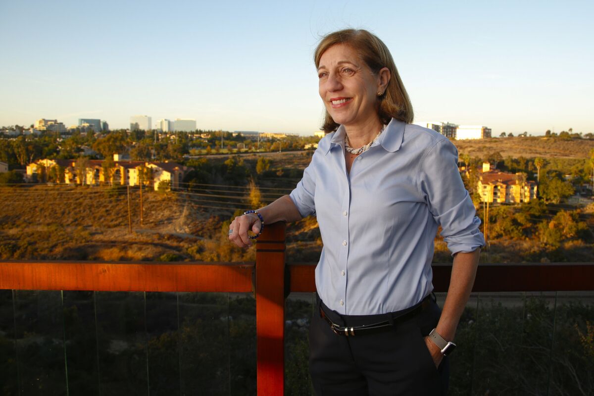 Mayoral canddiate Barbara Bry stands on a patio deck of a home that overlooks Rose Canyon in San Diego.