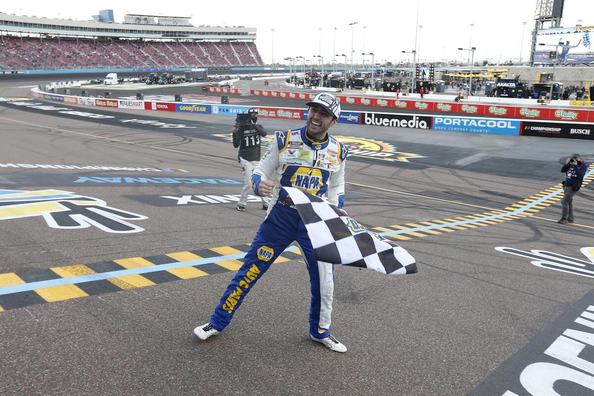 Chase Elliott celebrates at the finish line after winning the 2020 NASCAR Cup championship.