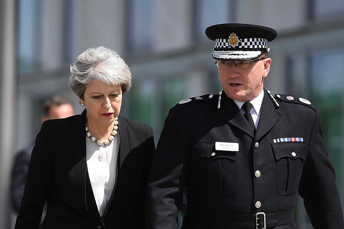 British Prime Minister Theresa May meets Chief Constable of Greater Manchester Police Ian Hopkins on May 23, 2017, in Manchester, the day after a terrorist attack in the city.