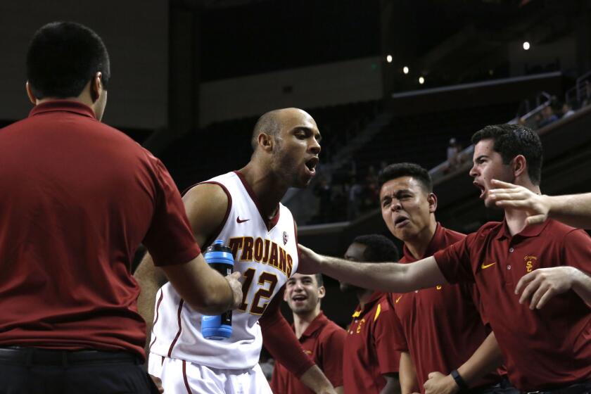 USC guard Julian Jacobs celebrates after a dunk against Colorado on Feb. 17.