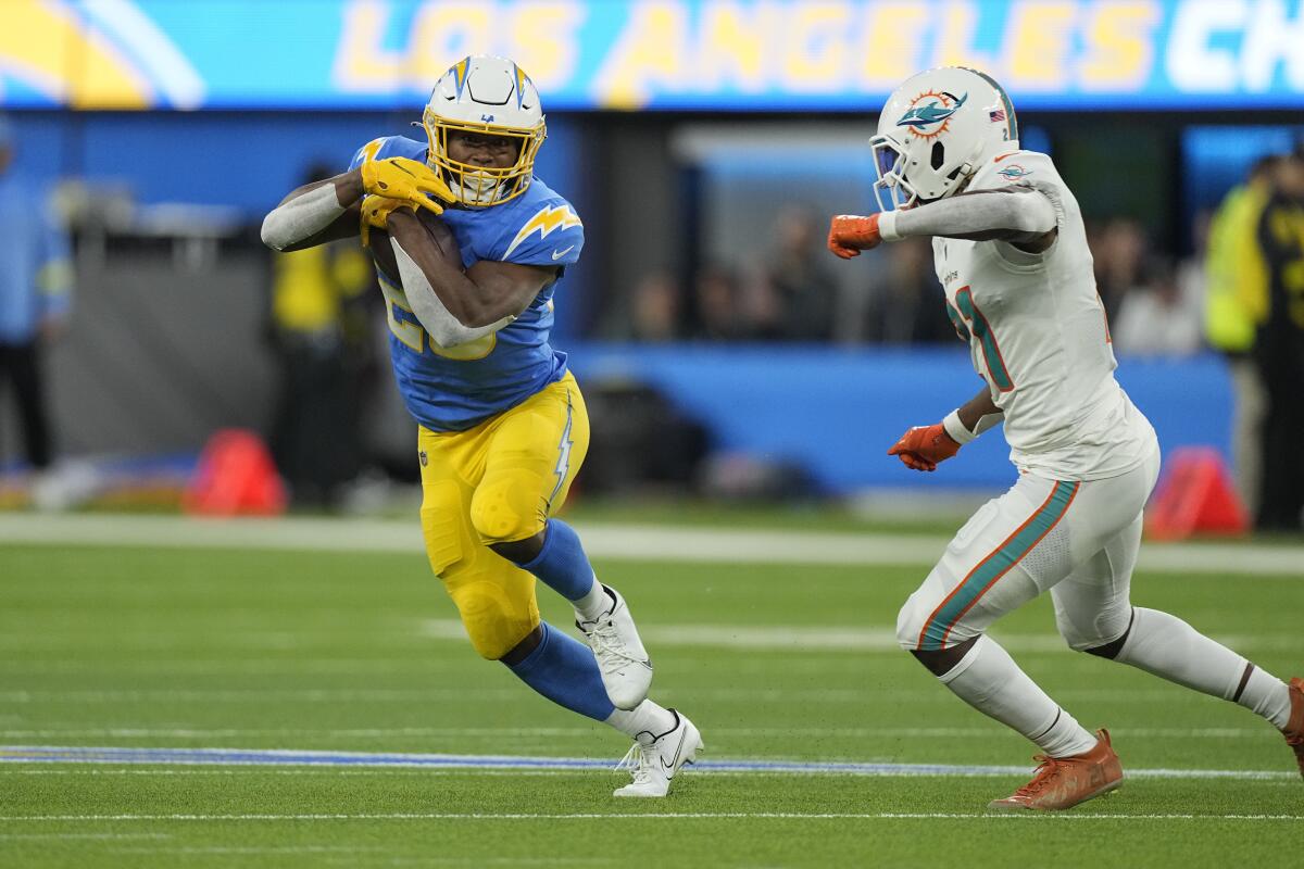 Chargers running back Joshua Kelley carries the ball against Miami Dolphins in the first half.