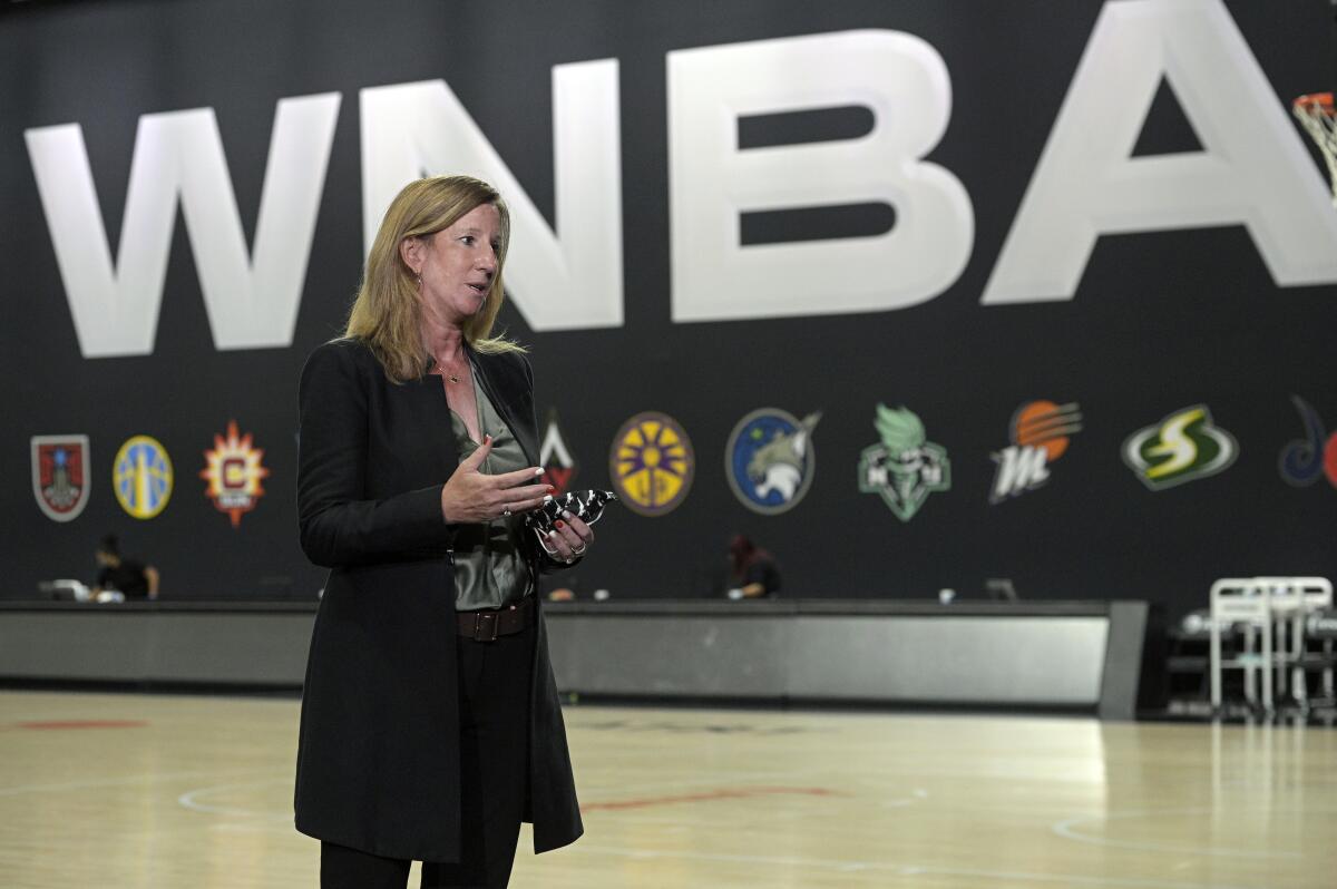 FILE - In this Sunday, Sept. 20, 2020, file photo, WNBA Commissioner Cathy Engelbert answers questions about a postponed game between the Seattle Storm and the Minnesota Lynx after Game 1 of a WNBA basketball semifinal round playoff game between the Connecticut Sun and the Las Vegas Aces, in Bradenton, Fla. The WNBA and the Players' Association have agreed to an opt-in process for this season's draft, the league confirmed to The Associated Press, late Sunday, March 7, 2021. (AP Photo/Phelan M. Ebenhack, File)