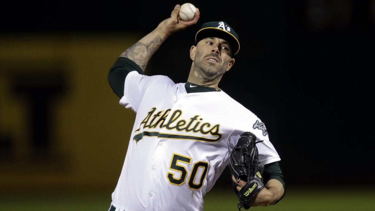 Oakland Athletics pitcher Mike Fiers works against the Cincinnati Reds during the first inning on Tuesday in Oakland. Fiers threw the first no-hitter this season.