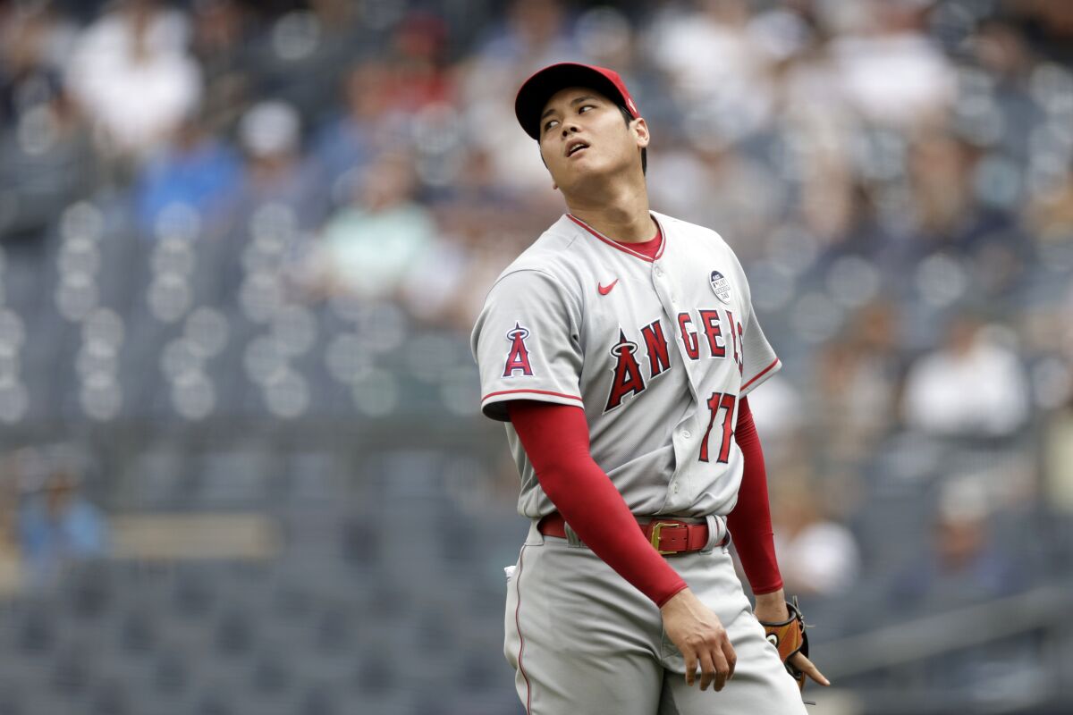 Angels pitcher Shohei Ohtani reacts to a play during the third inning of a game against the Yankees on Thursday in New York.
