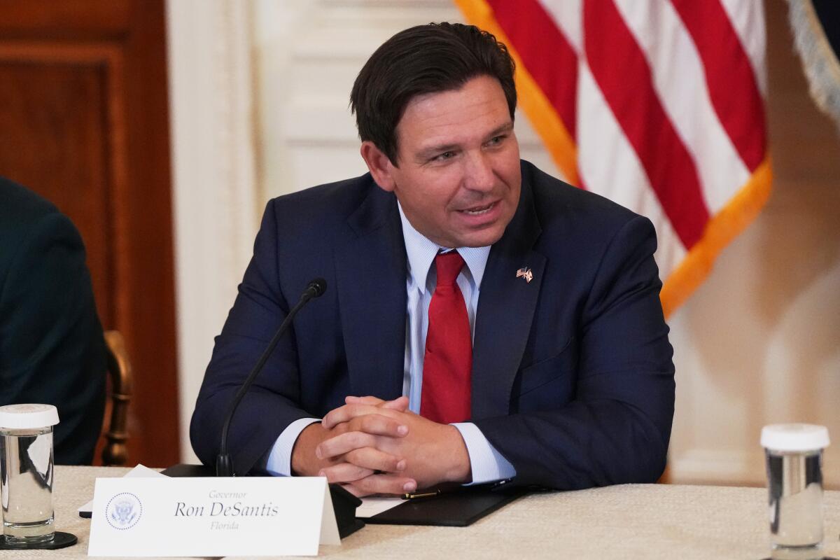 Florida Gov. Ron DeSantis at a roundtable discussion on college sports in the East Room of the White House