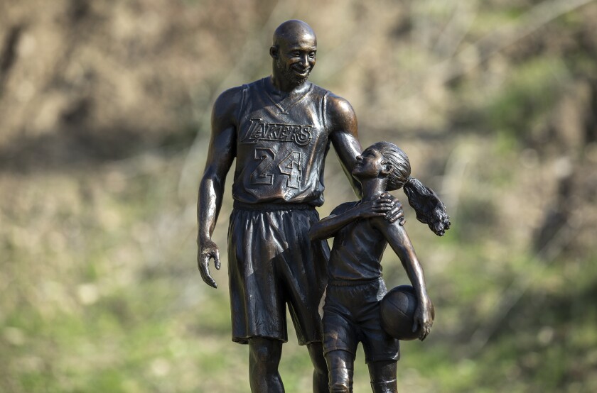 A bronze statue of Lakers legend Kobe Bryant and his daughter Gianna by sculptor Dan Medina.