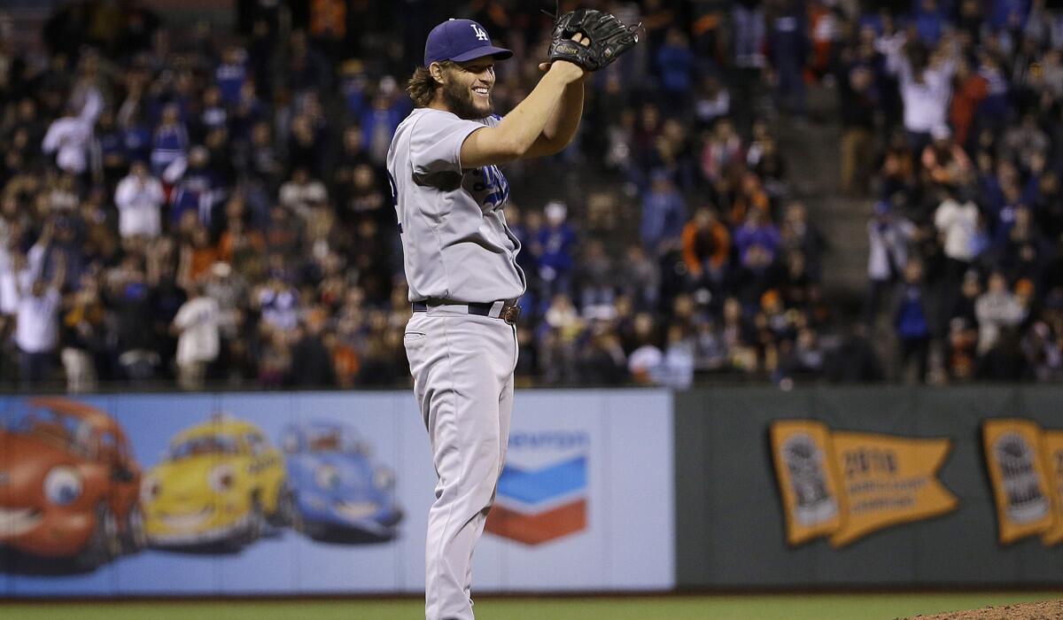 Dodgers pitcher Clayton Kershaw celebrates after the Dodgers beat the San Francisco Giants 8-0 on Tuesday.