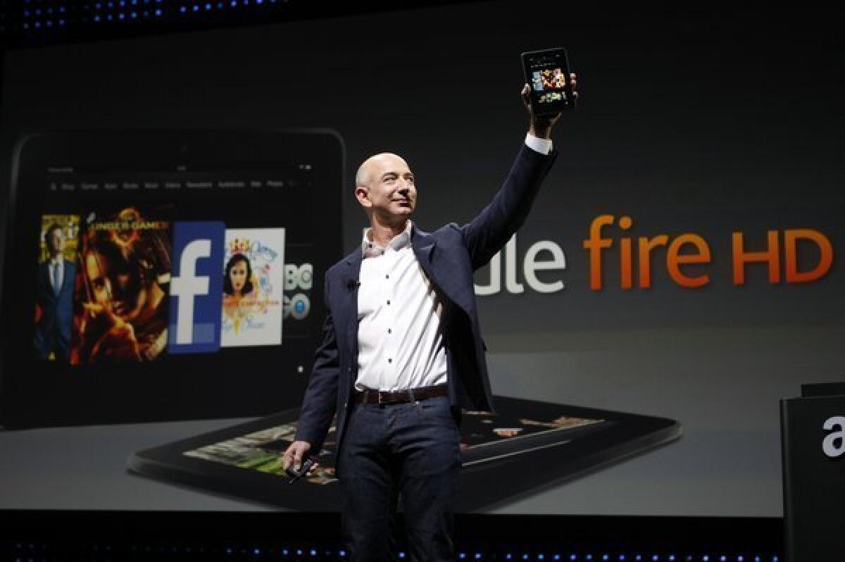 Amazon Chief Executive Jeff Bezos unveiling the Kindle Fire HD in September. Such tablet computers are helping to fuel the growth of e-book reading.