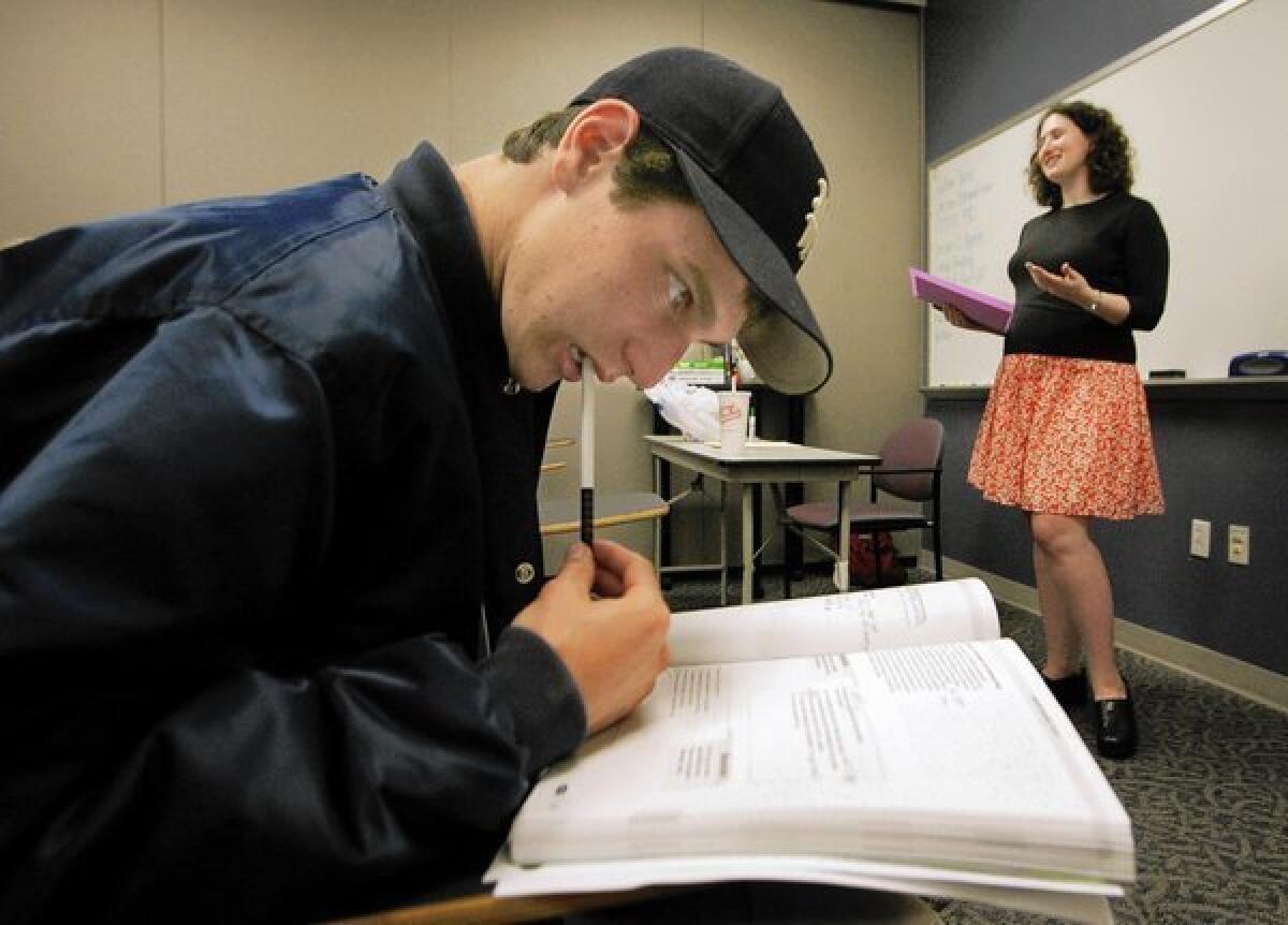 Student Adam Greene, 16, participates in a SAT prep class taught by Justine Borer, right, at Kaplan Test Prep and Admissions in Westwood in 2006.