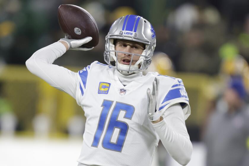 Detroit Lions quarterback Jared Goff (16) warms up before the start of an NFL football game.