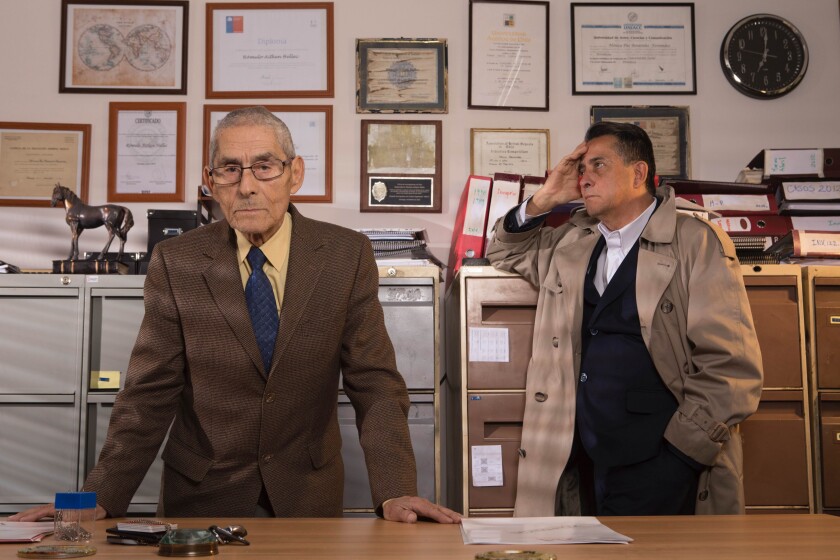 Sergio Chamy, left, is hired by private detective Romulo Aitken to investigate possible elder neglect in "The Mole Agent." 