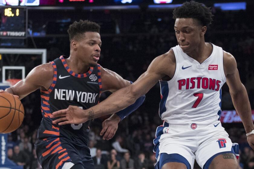 New York Knicks guard Dennis Smith Jr. (5) drives to the basket against Detroit Pistons forward Stanley Johnson (7) during the second half of an NBA basketball game, Tuesday, Feb. 5, 2019, at Madison Square Garden in New York. The Pistons won 105-92. (AP Photo/Mary Altaffer)