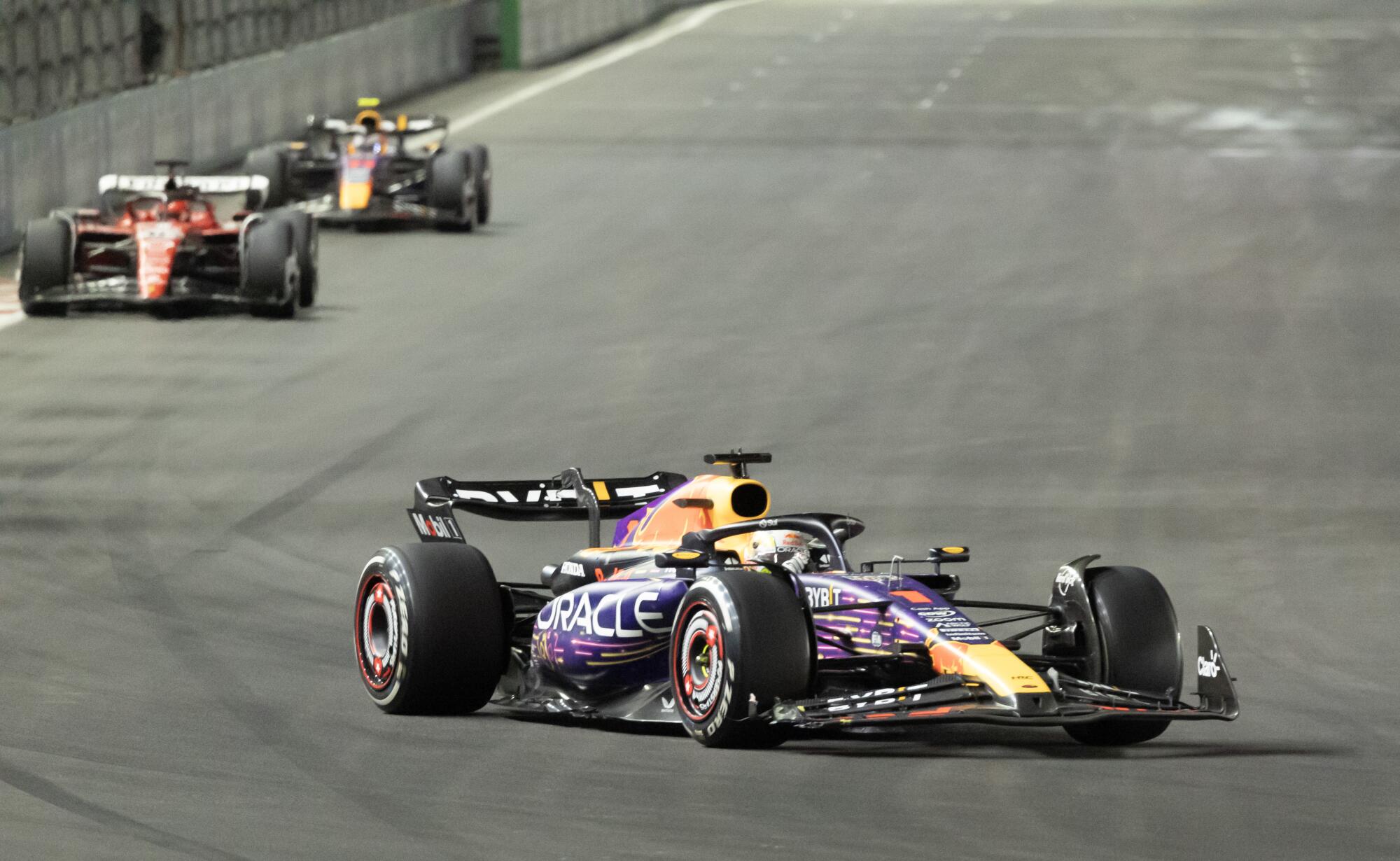 Red Bull's Max Verstappen leads Ferrari's Charles Leclerc and Red Bull's Sergio Perez during the Las Vegas Grand Prix 