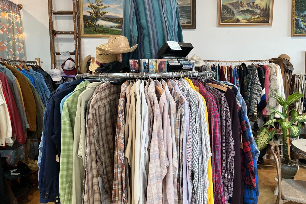 Racks of clothing in a thrift store 