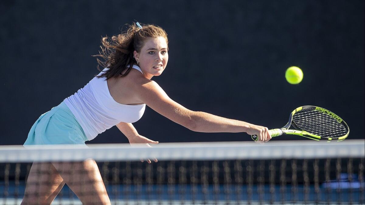 Corona del Mar High's Roxy MacKenzie returns a shot at the net during a No. 3 singles set against Palos Verdes on Wednesday.