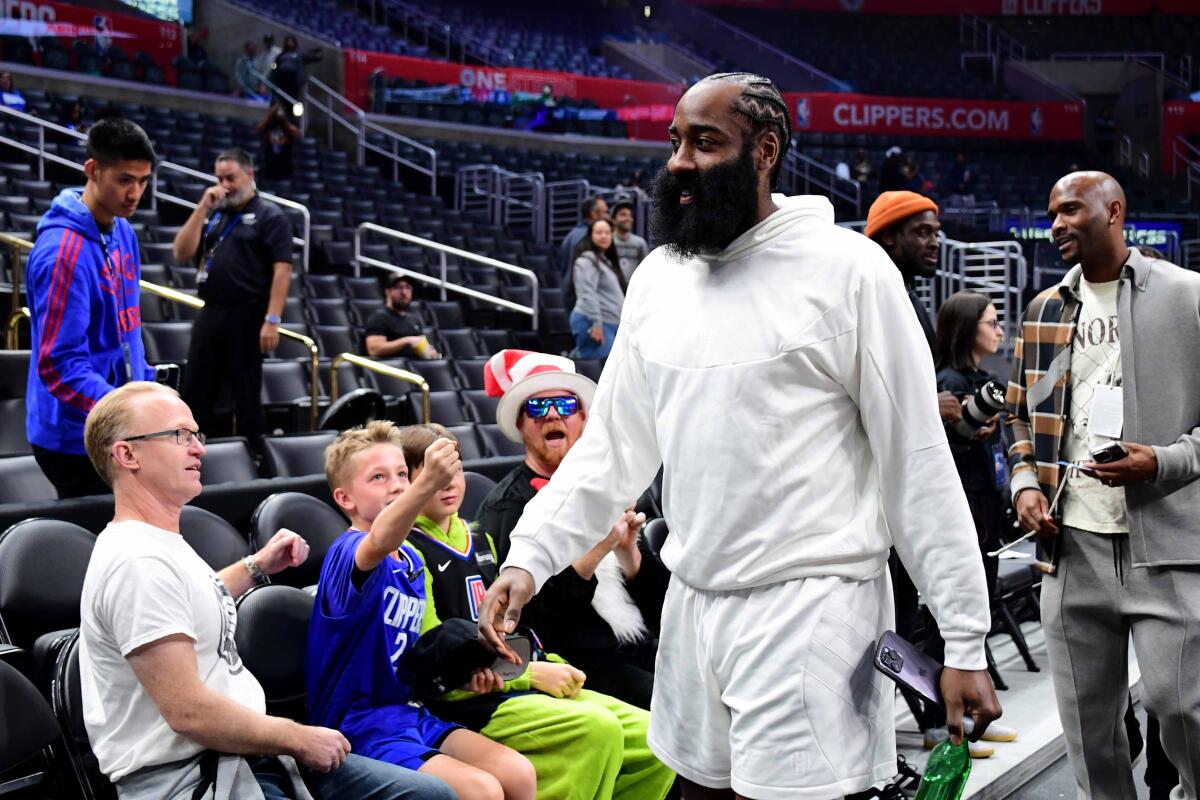 The Clippers' James Harden arrives to the arena before a game.