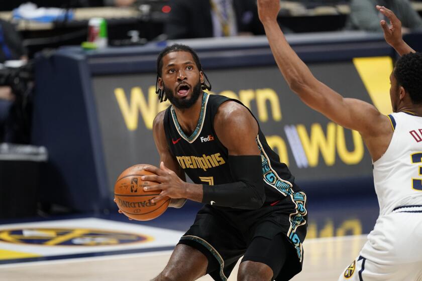 Memphis Grizzlies forward Justise Winslow (7) in the first half of an NBA basketball game Monday, April 26, 2021, in Denver. (AP Photo/David Zalubowski)