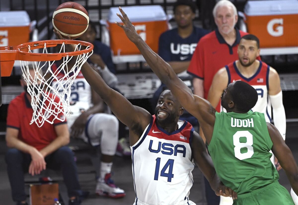 Draymond Green of the U.S. shoots against Nigeria's Ekpe Udoh during an exhibition game July 10, 2021.
