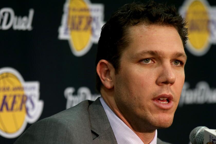 New Lakers Coach Luke Walton answers reporters' questions during a press conference on Tuesday at the team's training facility in El Segundo.