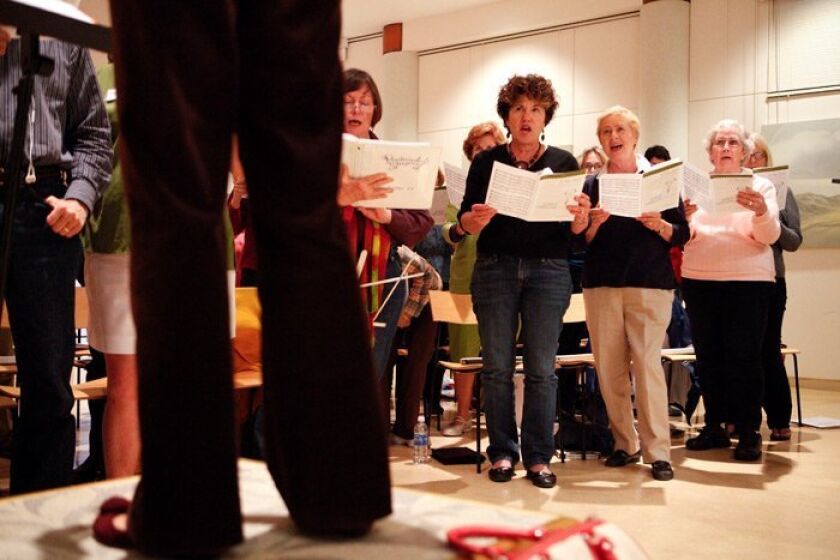The Peninsula Singers rehearse at the Hervey Family Point Loma Library. They performed at Carnegie Hall last month.
