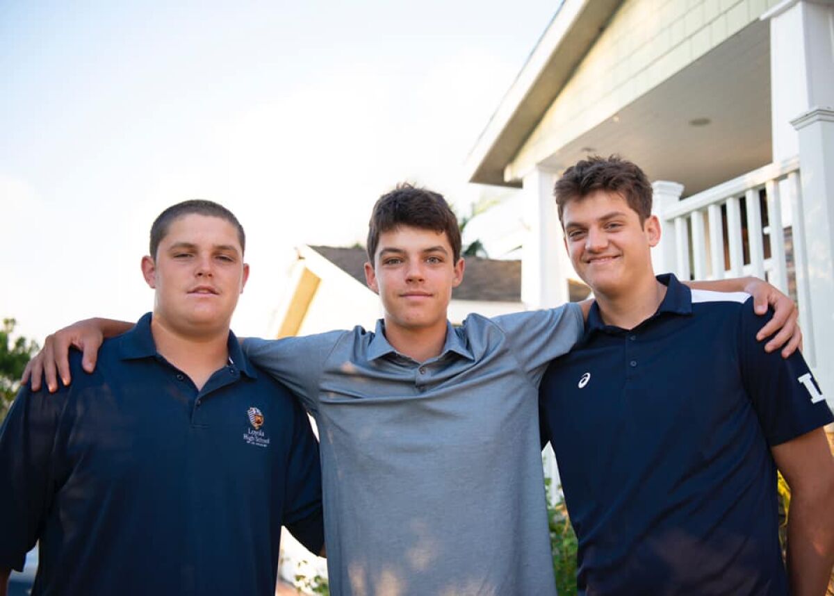 The Samuelson triplets at Loyola _ football player Hunter, left, and volleyball players Magnus and Jackson. They are the sons of former volleyball standout Bob Samuelson.