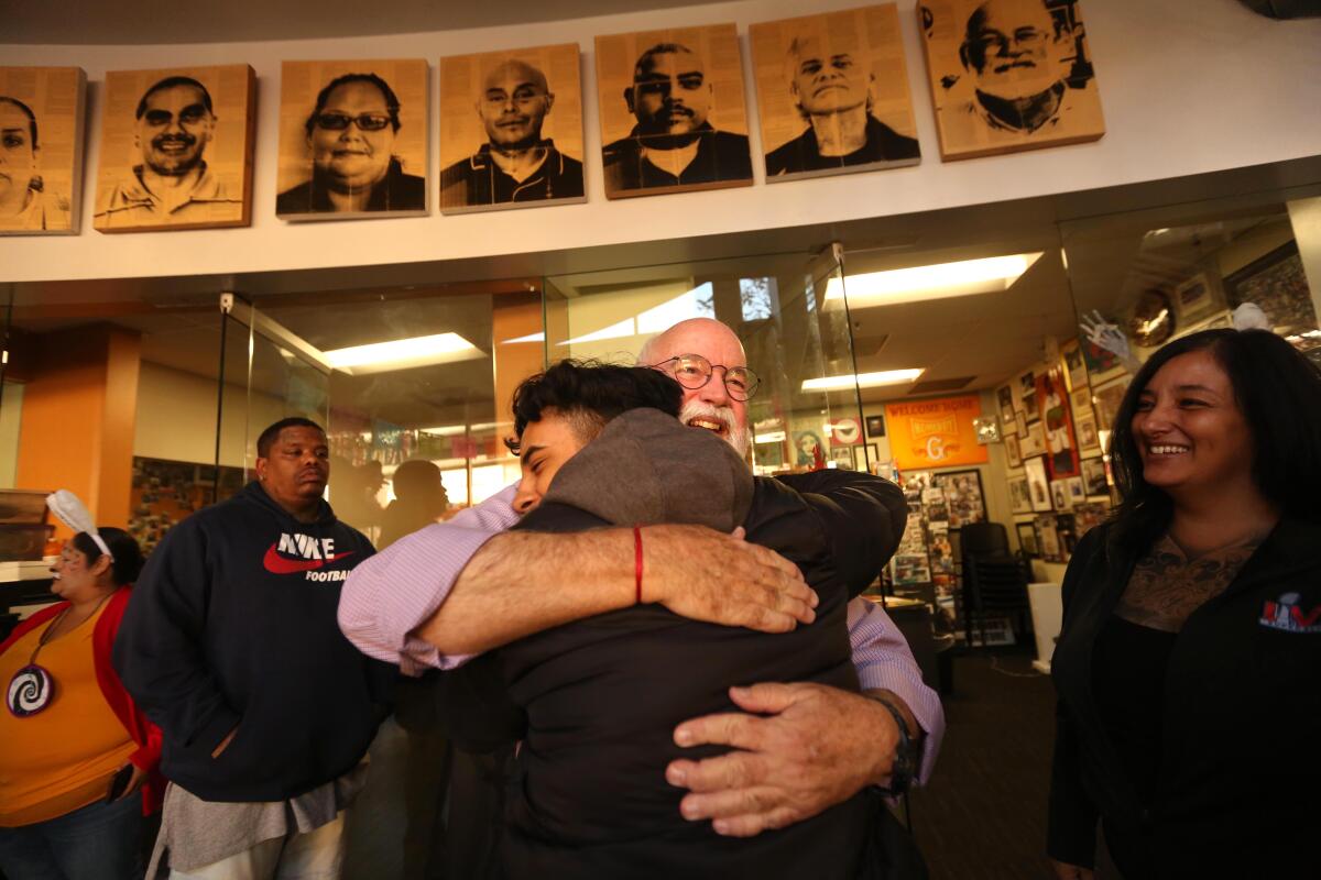 Father Greg Boyle counsels former gang members at Homeboy Industries in Los Angeles in 2022. 