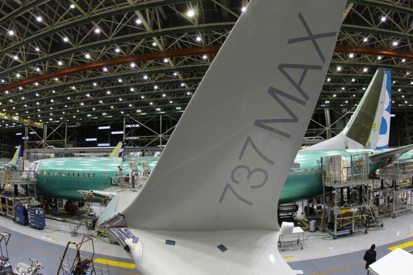 In this Monday, Dec. 7, 2015, photo, taken with a fisheye lens, the distinctive winglet on the second Boeing 737 MAX airplane being built is shown on the assembly line in Renton, Wash. On Thursday, March 3, 2016, the Commerce Department reports on U.S. factory orders for January. (AP Photo/Ted S. Warren)