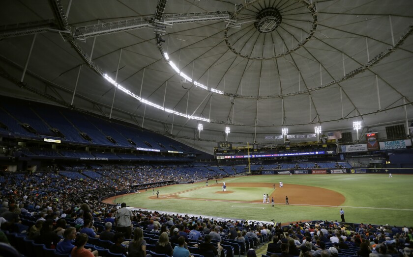 FILE - The Houston Astros play the Texas Rangers during the third inning of a baseball game at Tropicana Field in St. Petersburg, Fla., Aug. 29, 2017. The Tampa Bay Rays’ proposed plan to split the season between Florida and Montreal has been rejected by Major League Baseball. Rays principal owner Stuart Sternberg announced the news on Thursday, Jan. 20, 2022. (AP Photo/Chris O'Meara, File)