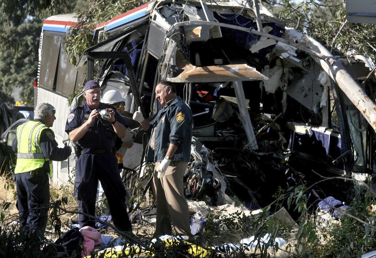 California Highway Patrol investigators inspect the Greyhound bus that crashed July 22, 2010, killing six.