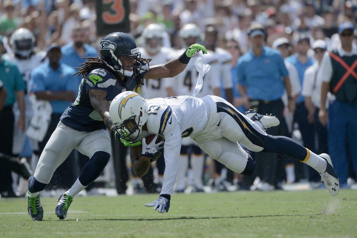 San Diego wide receiver Keenan Allen catches a pass Sept. 14 while defended by Seattle cornerback Richard Sherman.