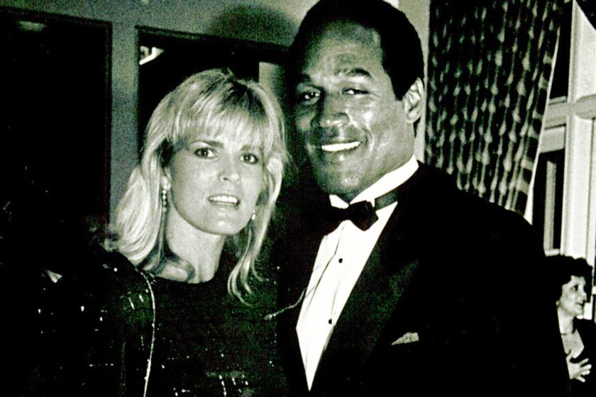 Nicole and O.J. Simpson at a benefit at the Ritz-Carlton in Dana Point in a 1989 file photo.