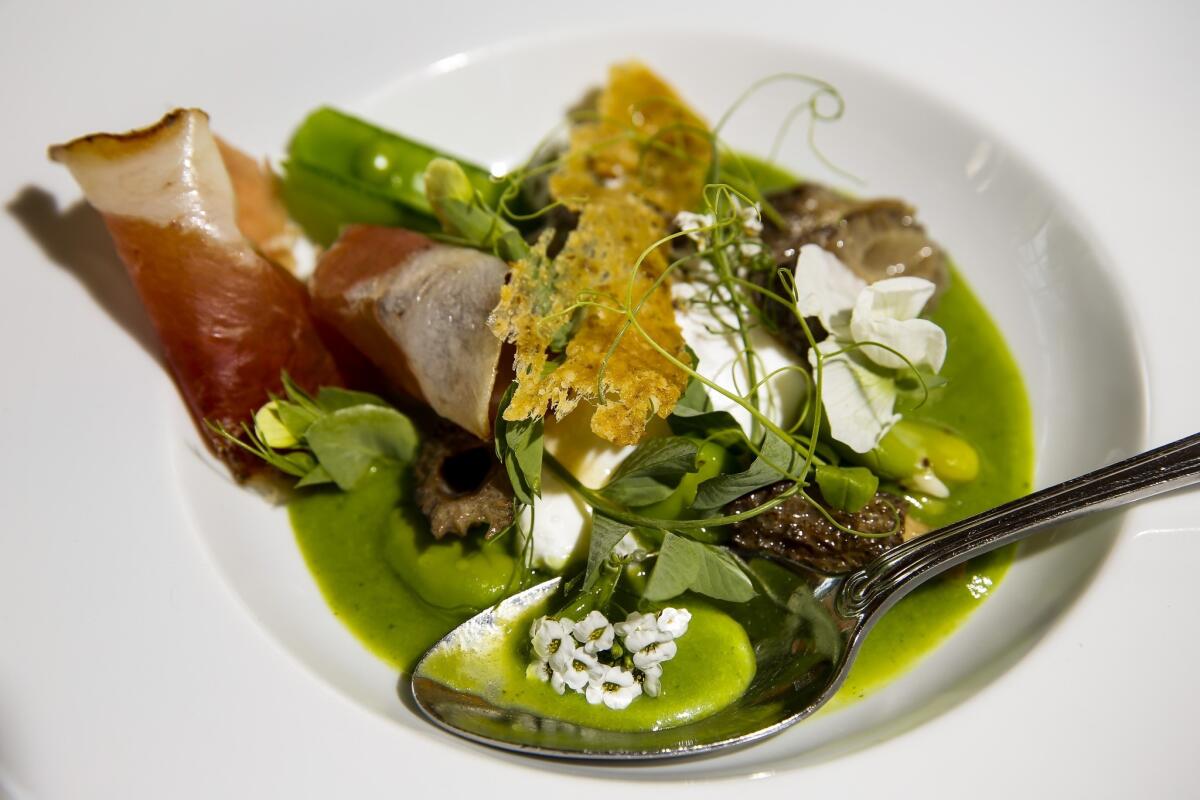 A beautifully plated dish of farm egg, spring soubise, morels and dandelion flavors from the Tasting Kitchen in Venice. According to a new study, pretty food tastes better.