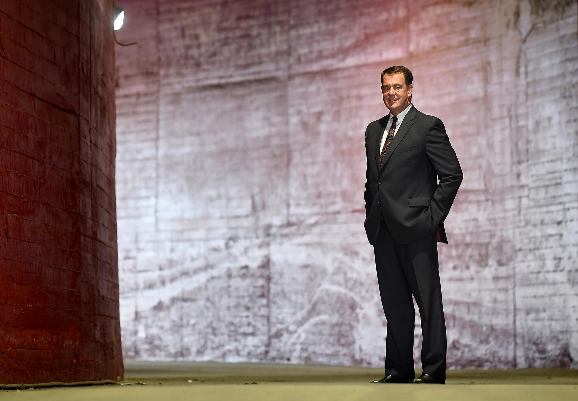 USC athletic director Mike Bohn stands in the tunnel of the Coliseum. 
