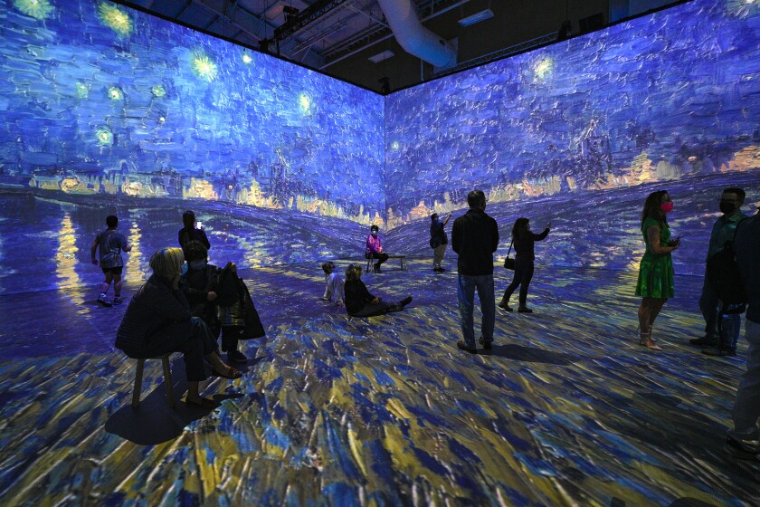 Guests at Wyland Center at Del Mar Fairgrounds, take in the immersive experience into the world of Vincent Van Gogh .
