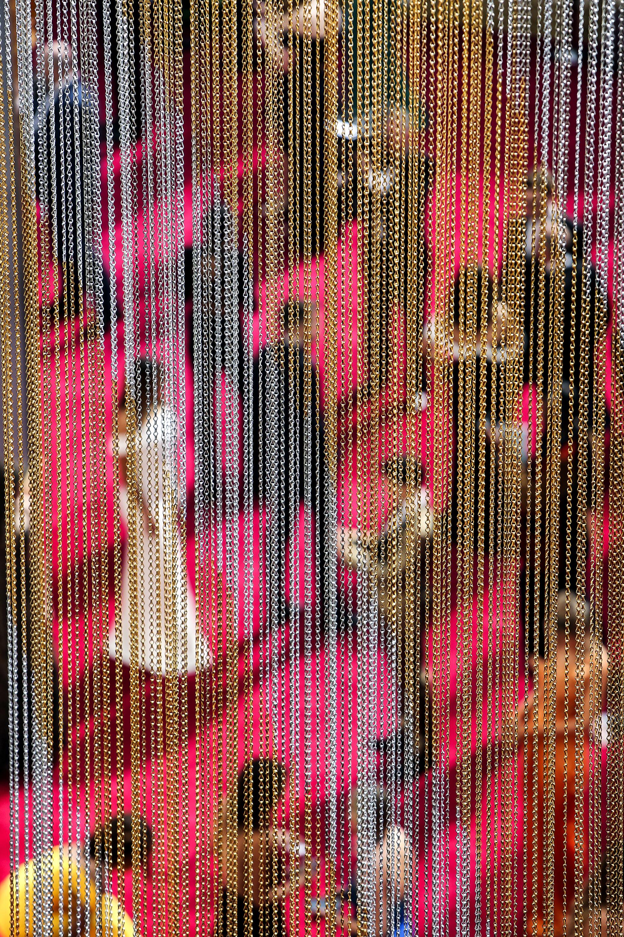 People on the Oscars red carpet seen from above through a beaded curtain on Feb. 9, 2020.